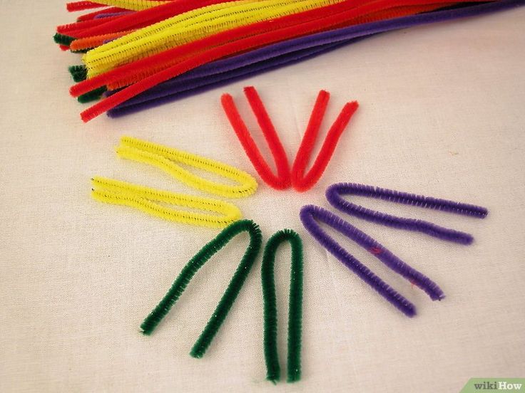 there are many different colored toothbrushes arranged in a circle on the white surface