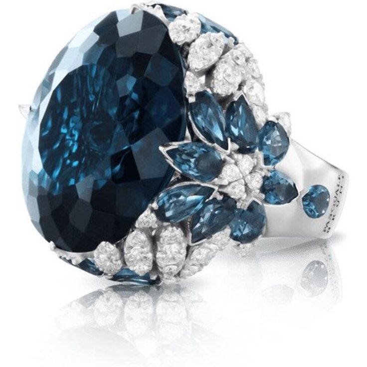 Indulge in pure luxury with the 18k White Gold Ghirlanda Couture Ring from Pasquale Bruni. This exquisite piece features a breathtaking London Blue Topaz gemstone that sparkles in the light, surrounded by a halo of diamonds that perfectly complement its blue hues. The ring's intricate design is reminiscent of delicate garlands, creating a truly unique and timeless piece that exudes elegance and sophistication.Crafted from the finest 18k white gold, this ring is a true masterpiece of Italian craf Pasquale Bruni, Diamond Birthstone, Jewelry Appraisal, London Blue Topaz, Topaz Gemstone, London Blue, Diamond Wedding Rings, White Gold Rings, Cocktail Rings