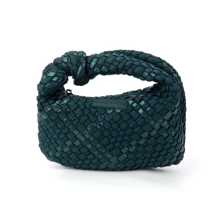 Our handwoven Knot bags are perfect for any occasion! Whether you're headed to a casual brunch, fancy event or a night on the town, this unique bag will make just the right statement. Woven neoprene & Lycra blend Zipper enclosure Shiny gunmetal tone hardware Dimensions: 11" L x 7" H x 2” D, Handle Drop: 3” Modern Clutch Bag With Braided Handles, Versatile Woven Bags For Errands, Chic Woven Bags, Chic Woven Bags For Errands, Modern Woven Evening Bag, Green Woven Leather Evening Bag, Trendy Woven Leather Evening Bag, Green Evening Bag With Braided Handles, Trendy Evening Bags With Intrecciato Weave