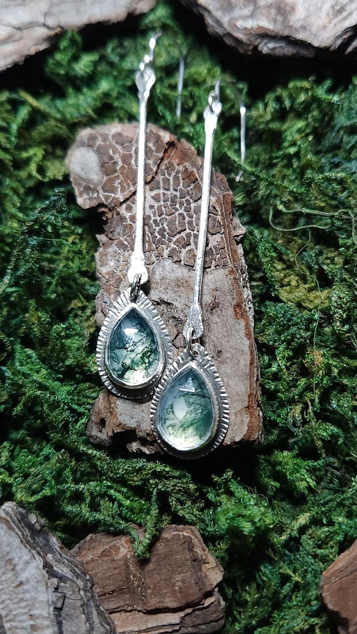 A pair of long dangles inspired by mother nature, featuring crystal clear and mossy green moss agate stones, suspended form finely textured silver wires. Finished with sterling silver earring hooks.  Lovingly made from sterling and fine silver and moss agate stones, by my two hands in sunny Brisbane.  All my items are either original, one of a kind or made in small batches.  These earrings would make a perfect gift to a loved one or a friend who enjoys handcrafted personal adornments that are ma Unique Natural Inclusion Drop Earrings, Bohemian Drop Earrings With Natural Inclusions, Nature-inspired Drop Earrings With Natural Inclusions, Green Moss Agate Earrings For Gift, Unique Drop Earrings With Natural Inclusions, Nature-inspired Drop Earrings With Lever Back Ear Wires, Nature-inspired Dangle Earrings, Unique Green Long Drop Jewelry, Nature-inspired Green Teardrop Earrings