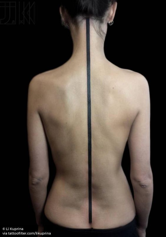 the back of a woman's body with black lines on her upper and lower back