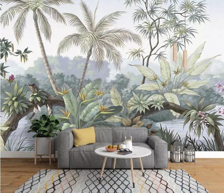 a living room scene with a couch, table and tropical wall mural on the wall