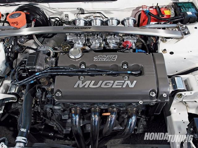 the engine compartment of a car with its hood open