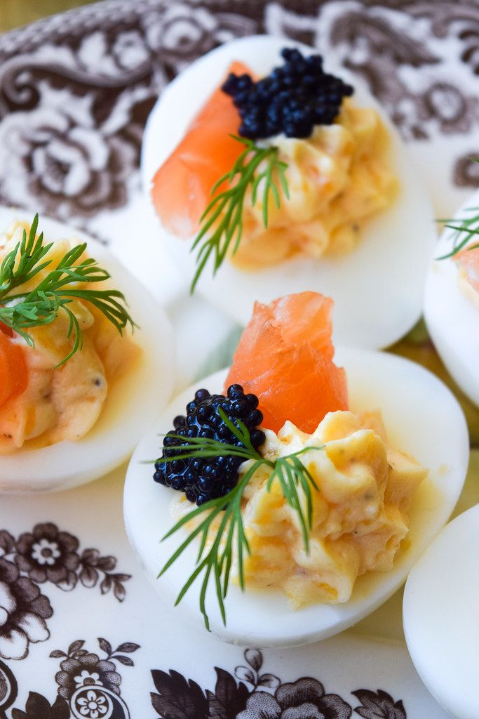 deviled eggs topped with smoked salmon and cavias