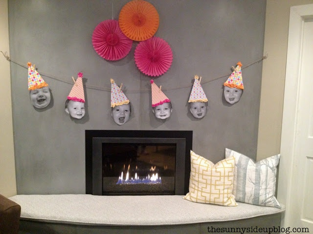 the fireplace is decorated with paper hats and candles