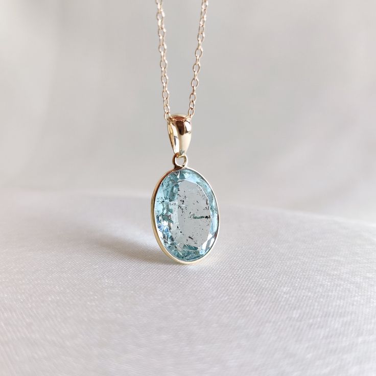 This stunning pendant is set in 14K Solid Yellow Gold with Natural Aquamarine with utmost precision. It is an unique gemstone pendant for nearly every occasion and is completely hassle-free jewelry. 🔷ABOUT GEMSTONE: Aquamarine is often considered a calming and soothing stone. It may help reduce stress, anxiety, and feelings of overwhelm, promoting a sense of tranquility and peace. Aquamarine is thought to enhance courage and inner strength. It may help individuals overcome fears and phobias and Aquamarine Jewelry Necklace, Aquamarine Gem, Handmade Jewelry Box, Aquamarine Pendant, Aquamarine Jewelry, March Birthstone, Bezel Pendant, Fancy Jewellery, Birthstone Pendant