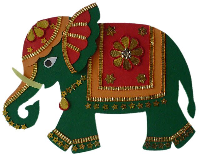 an elephant made out of paper and decorated with flowers on it's back, standing in front of a white background