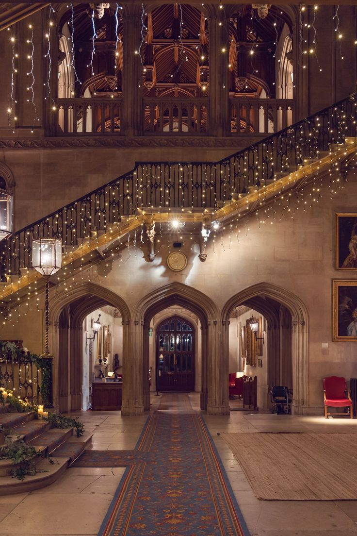 an ornate building with stairs and lights on the ceiling