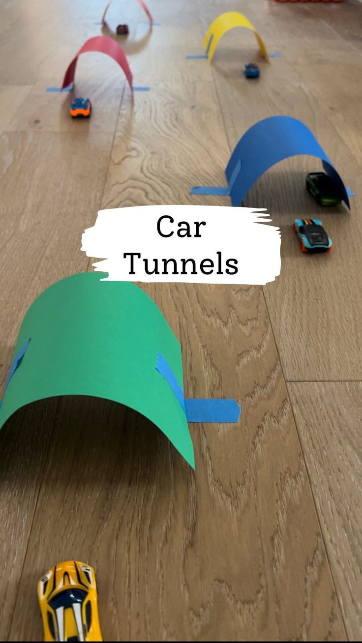 car tunnel made out of construction paper on the floor