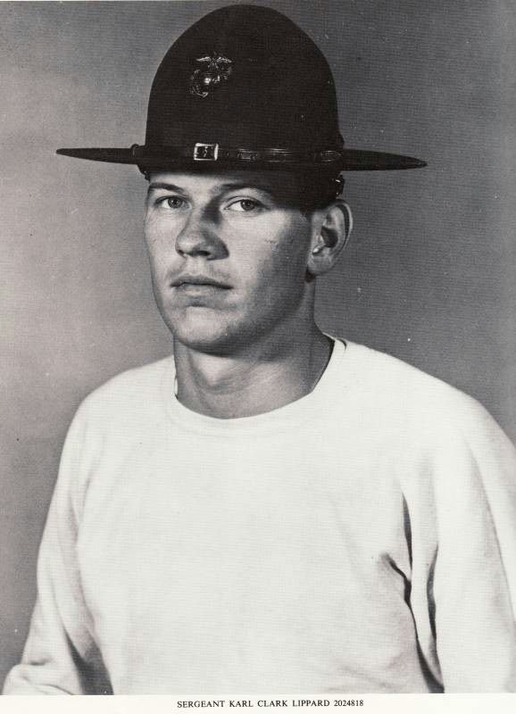 an old black and white photo of a baseball player wearing a hat on his head