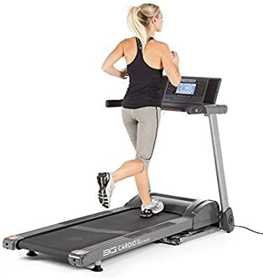 a woman running on a treadmill with the words fitrof treadmill in front of her