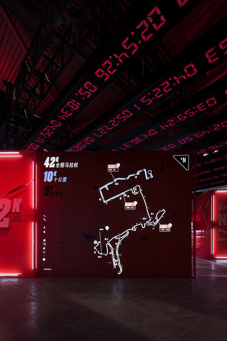 an image of a red room with neon signs and numbers on the wall that are lit up