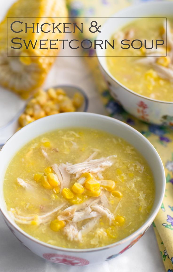 two bowls of chicken and sweetcorn soup on a table