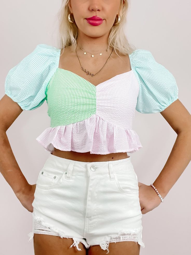 Sweet Seersucker Ruffle Top | Sassy Shortcake | sassyshortcake.com Cute Puff Sleeve Top With Ruffles For Spring, Trendy Green Cotton Puff Sleeve Top, Trendy White Puff Sleeve Top With Ruffles, Multicolor Smocked Top With Ruffles For Spring, Summer Pink Puff Sleeve Top With Smocked Bodice, Trendy Striped Puff Sleeve Top, Spring Multicolor Smocked Top With Ruffles, Cotton Puff Sleeve Top With Ruffle Hem For Spring, Trendy Puff Sleeve Top With Ruffles And Balloon Sleeves