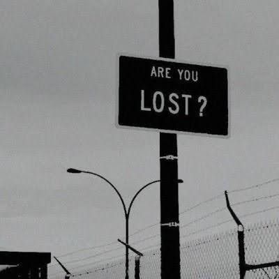 a black and white photo of a sign that says are you lost?