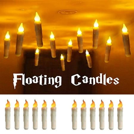 many candles are lit in front of a wall with the words floating candles on it