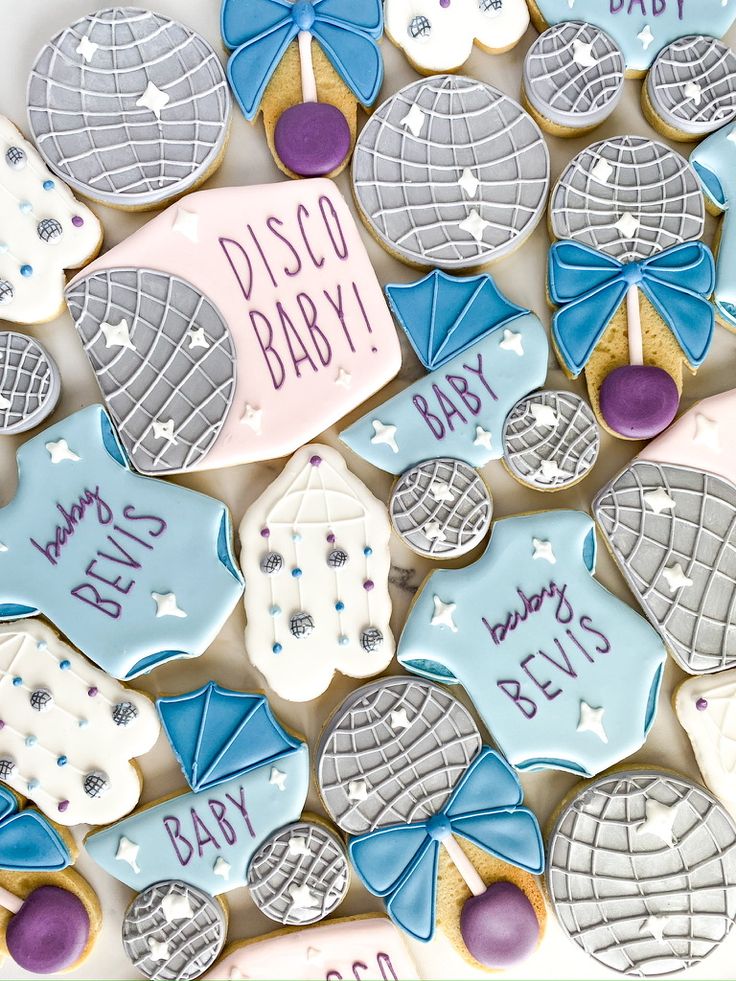 decorated cookies with baby names and umbrellas on them