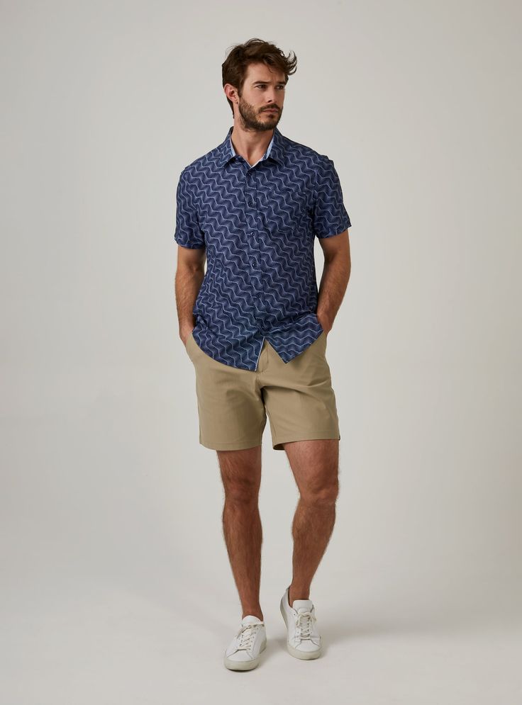 We created the perfect short sleeve button up, with the right mixture of comfort and style, just for you. Our performance shirts have 4-way stretch, are moisture wicking, wrinkle resistant and above all a great new addition to your wardrobe. The performance shirt will be your go-to for any occasion - day to night. This is a shirt that will have you satisfied at any given time. Details Model is 6'1" and wears a size medium. Care: Machine wash cold on delicate cycle, low tumble dry, do not iron Co Casual Navy Short Sleeve Shirt For Summer, Navy Collared Short Sleeve Shirt With Relaxed Fit, Navy Relaxed Fit Collared Short Sleeve Shirt, Casual Navy Collared Short Sleeve Shirt, Navy Tops For Summer Golf, Navy Short Sleeve Shirt For Summer, Navy Relaxed Fit Short Sleeve Shirt For Summer, Casual Short Sleeve Shirt With 4-way Stretch, Blue Short Sleeve Top With 4-way Stretch