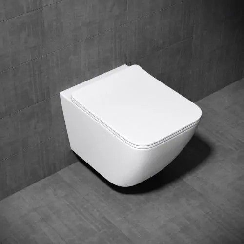 a white toilet sitting on top of a gray tiled floor next to a black and white wall