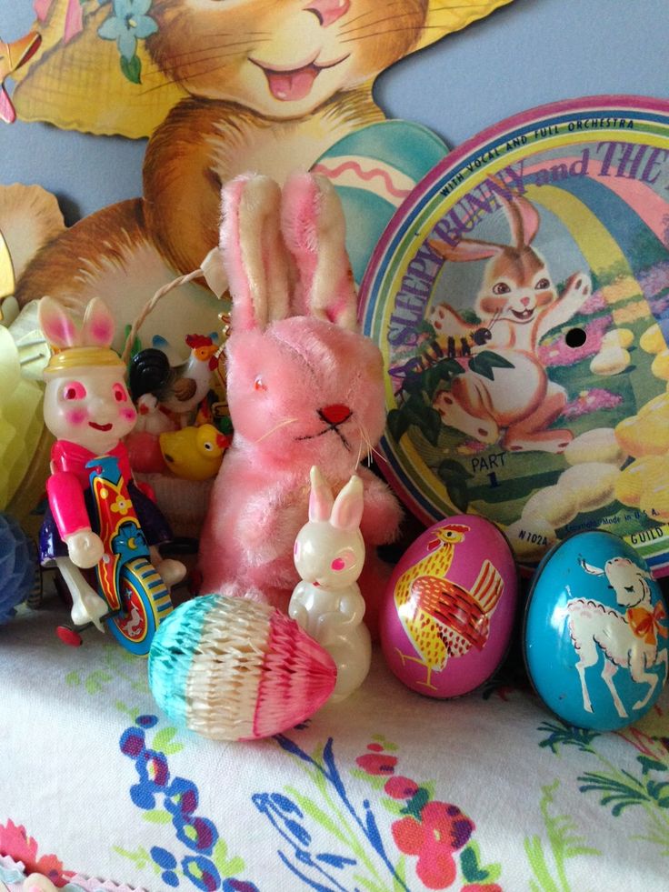 an assortment of easter decorations and toys on a table