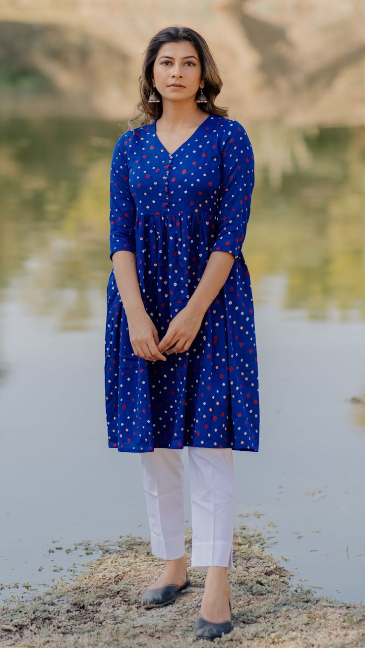 This gathered A-line Bandhej kurta in blue is perfect for all special occasions. You can even wear it as a dress for a leisure day out. Blue Casual Straight Kurta, Blue Casual Kurta For Festive Occasions, Casual Blue Kurta For Festive Occasions, Blue Casual Festive Kurta, Casual Blue Festive Kurta, Blue Festive Casual Kurta, Blue Fitted Tunic Kurta, Blue Tunic Kurta For Festivals, Casual Summer Blue Kurta