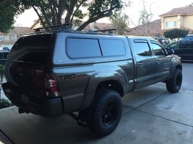 the truck is parked on the side of the street