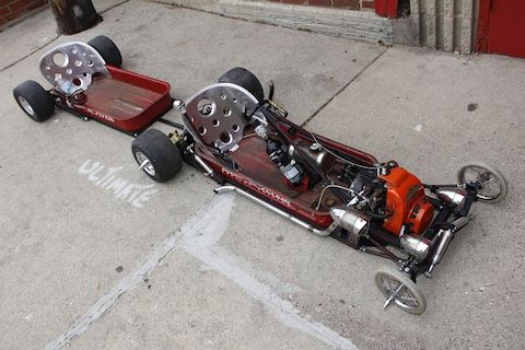 an upside down race car sitting on the ground