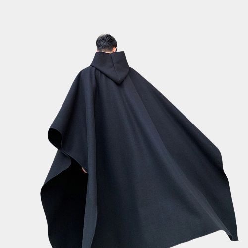 Long Techwear Poncho Oversized Hooded Cape For Cold Weather, Black Cape Styled As Long Coat For Fall, Black Long Cape For Fall, Black Cape For Fall, Black Winter Cape For Outdoor, Black Hooded Poncho For Outdoor, Black Winter Outdoor Cape, Black Hooded Cape For Fall, Hooded Black Cape For Fall