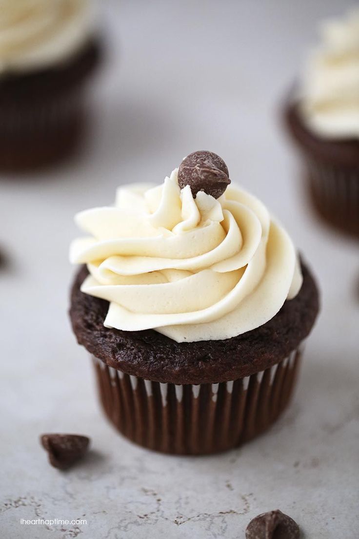 cupcakes with white frosting and chocolate chips