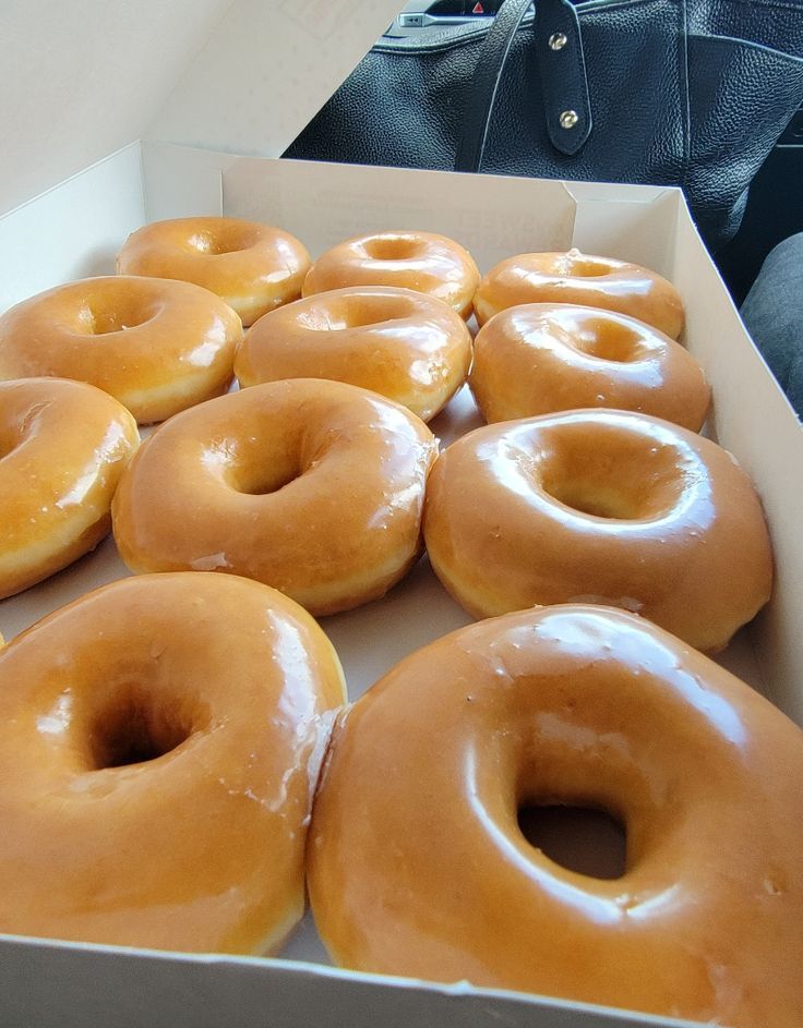 there are many glazed donuts in the box