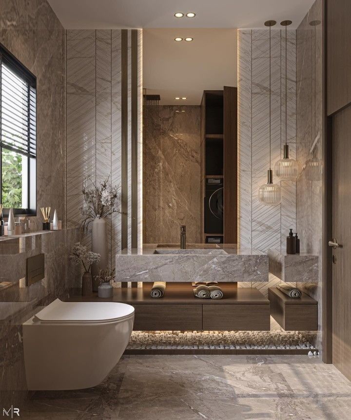 an elegant bathroom with marble walls and flooring