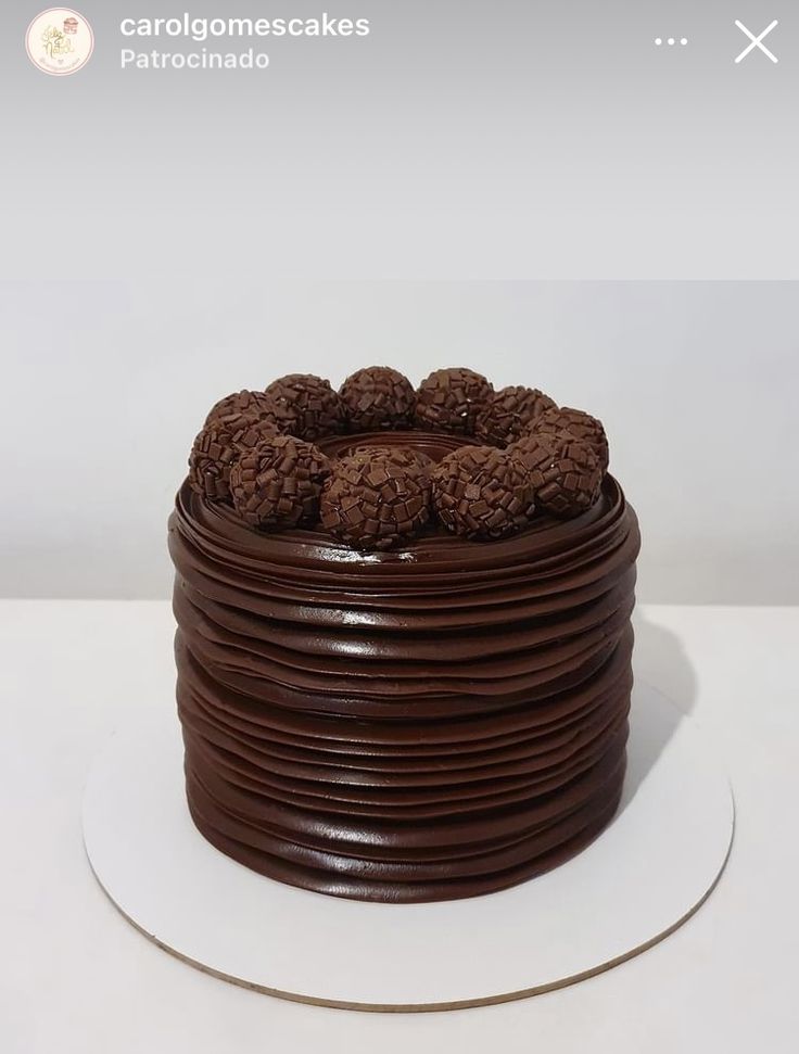 a cake with chocolate frosting and cookies on top