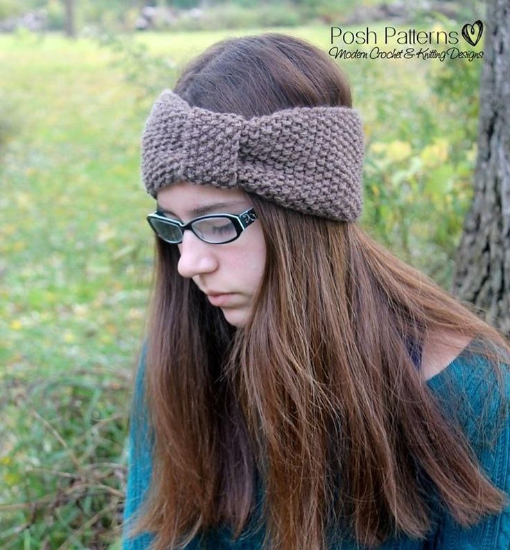 a woman wearing glasses and a knitted headband