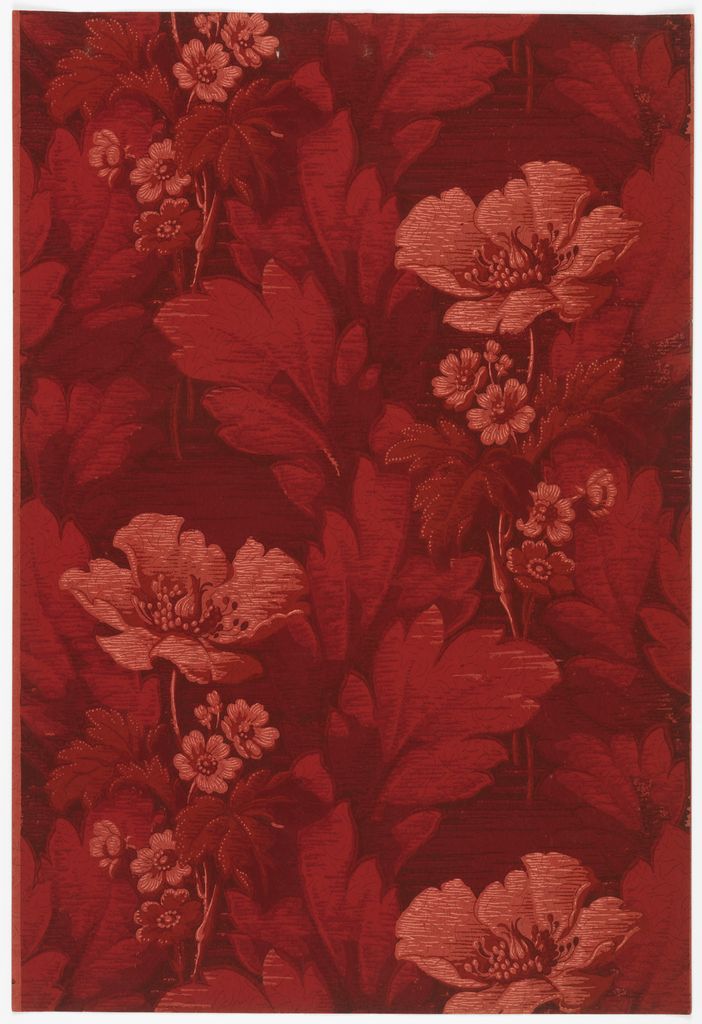 a red floral wallpaper with large leaves and flowers on the bottom half of it