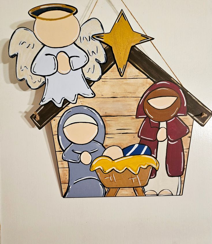 a nativity scene hanging on the wall