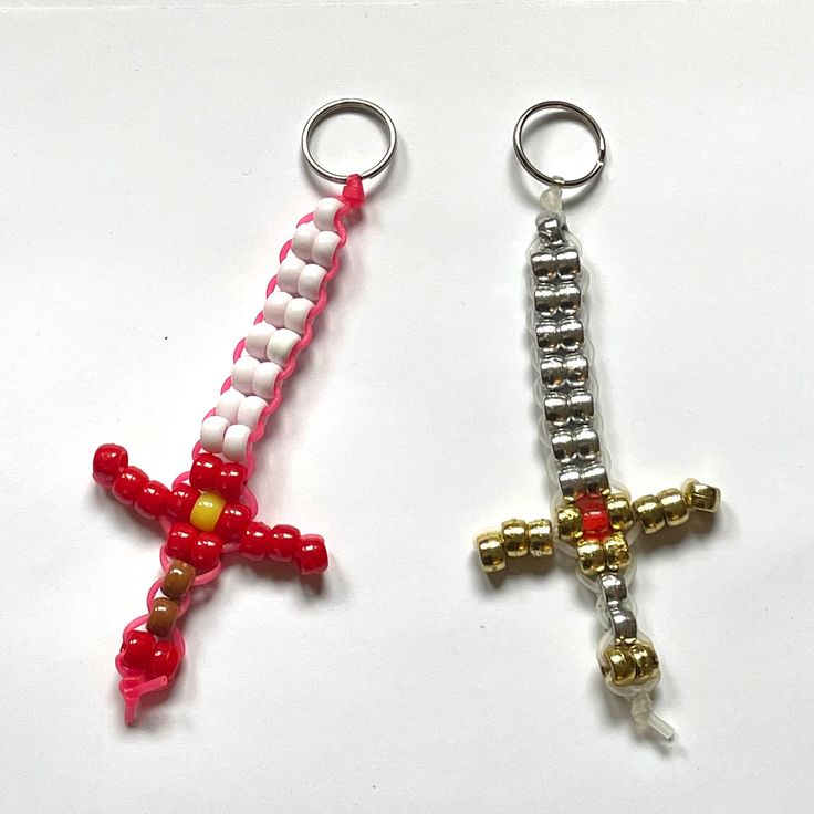 Handmade with pony beads. About 5 X 2.5 inches. Colors and size may vary slightly. Each sword comes with a metal ring or clip. Keychains are perfect for backpacks, purses, tote bags, pin boards, wall decor, and more. Minecraft Pony Bead Patterns, Pony Bead Bag Pattern, Diy Pony Bead Crafts, Crafting With Beads, Bead Keychain Diy Pattern, Pony Bead Projects Key Chains, Seed Bead Animals Patterns Easy, Bead Ideas Crafts Diy Projects, Easy Pony Bead Patterns