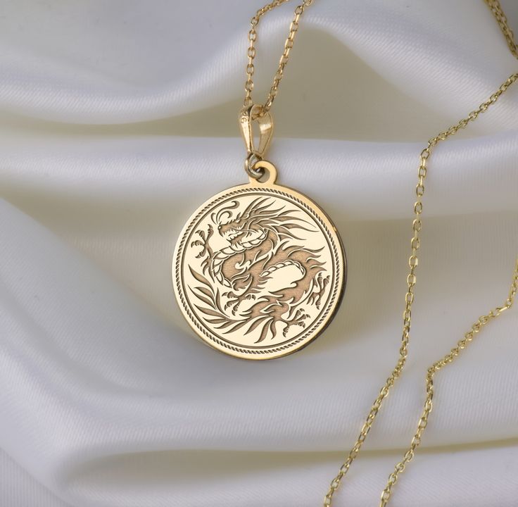 🐉 Step into the enchanting realm of Chinese New Year with our mesmerizing dragon necklace! 🎉 Crafted with meticulous attention to detail, this exquisite piece is a vibrant celebration of tradition, strength, and auspicious beginnings. Imagine the majestic dragon, intricately designed with shimmering scales ✨ and fierce claws, symbolizing power and resilience. With each wear, you'll embody the spirit of this mythical creature, carrying with you the energy of the Lunar New Year. 🌟 * Gender : Male / Female * Material Options : Silver, Gold Plated, Rose Gold, 14K Solid Gold * Thickness of Silver Pendant: 1.0 mm * Thickness of Gold Pendant: 0.8 mm * The Gold Plated and The Rose Gold Plated options are applied to 925 Sterling Silver with solution that contains 14K Gold. * There are several op Majestic Dragon, Mythical Dragons, Dragon Necklace, Mythical Creature, Crafts Jewelry, Dragon Pendant, Chinese Traditional, Diy Crafts Jewelry, Necklace Silver