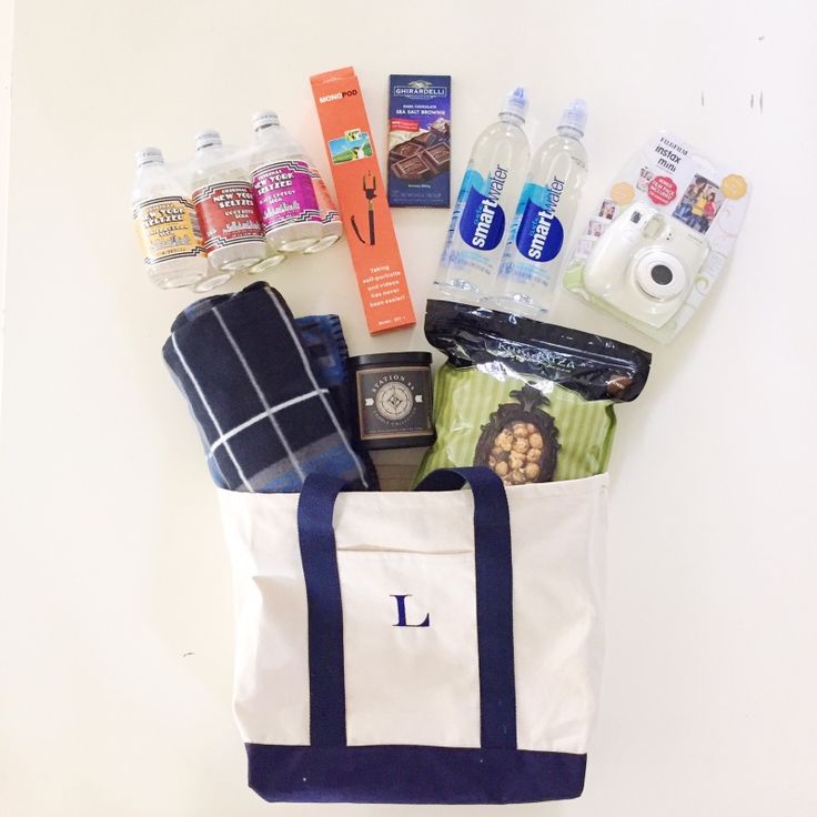 a tote bag filled with personal care items and toiletries sitting on top of a table