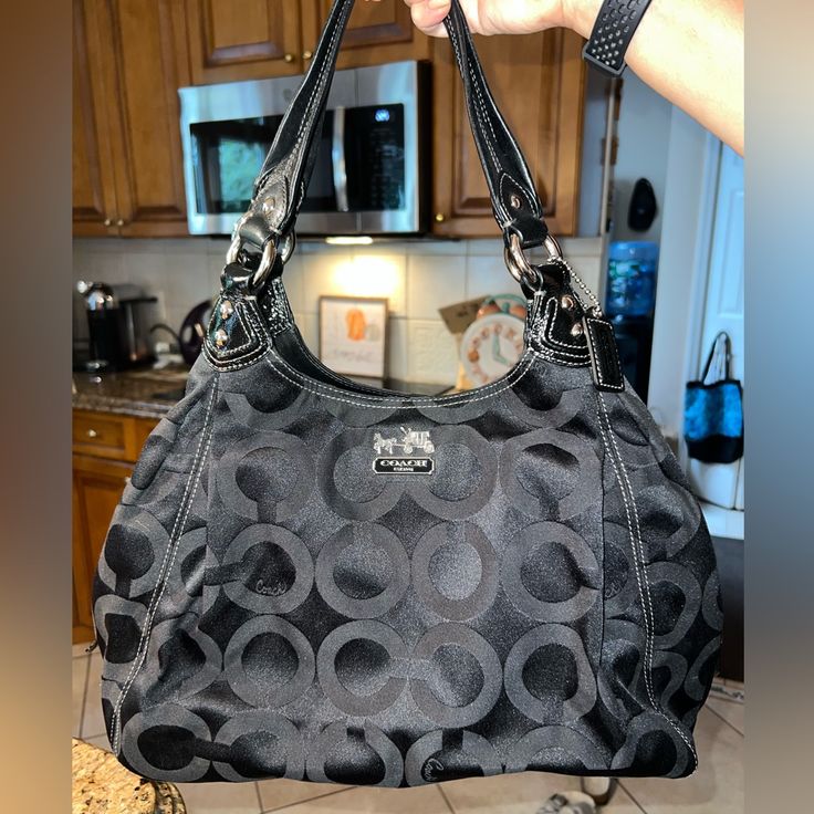 Great Condition Black Hobo Bag With Silver-tone Hardware For Evening, Coach Black Bag With Detachable Handle, Formal Black Hobo Bag With Silver-tone Hardware, Black Hobo Bag With Silver-tone Hardware And Double Handle, Black Hobo Bag With Gunmetal Hardware, Black Coach Shoulder Bag With Detachable Handle, Coach Black Shoulder Bag With Removable Pouch, Black Hobo Bag With Silver-tone Hardware For Everyday, Black Hobo Bag With Double Handle