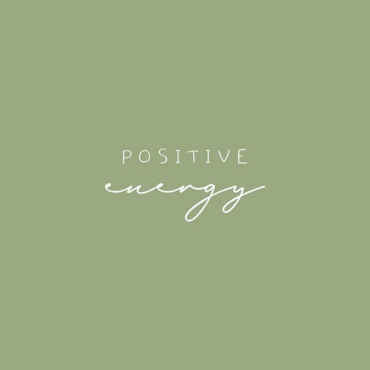 the words positive energy are written in white ink on a green background with a black and white