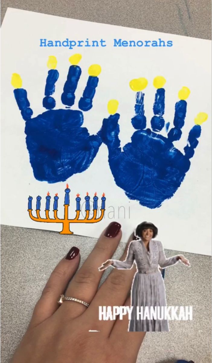 someone is holding up their handprint for hanukkah