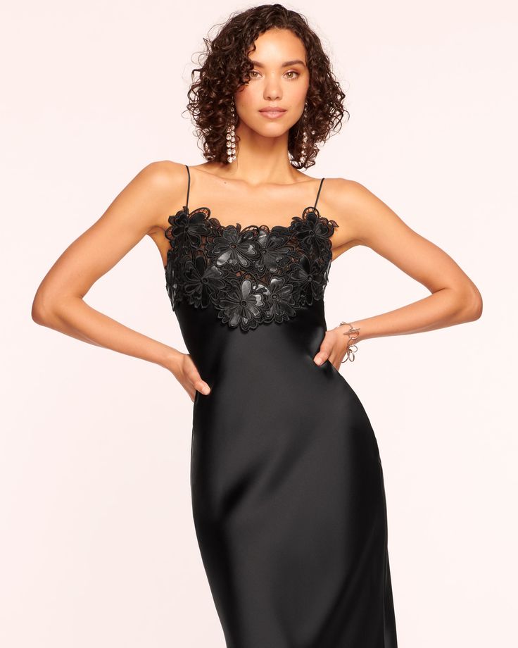 Make a statement at your next black tie affair in the Elora, an alluring silky satin slip dress with a dramatic touch. Adorned with laser-cut faux leather floral embellishments that enhance the bodice and highlight your frame, embrace your elegance when you step out in the Elora. Size & Fit – Fits true to size, tak Spaghetti Strap Dress With Lace Bodice For Night Out, Fitted Glamorous Satin Finish Slip Dress, Glamorous Fitted Satin Finish Slip Dress, Sheer Bodice Spaghetti Strap Evening Dress, Satin Evening Dress With Lined Bodice For Night Out, Evening Dresses With Sheer Bodice Spaghetti Straps, Satin Dress With Lace Bodice For Party, Summer Evening Dress With Lace Bodice, Chic Evening Slip Dress With Lace Bodice