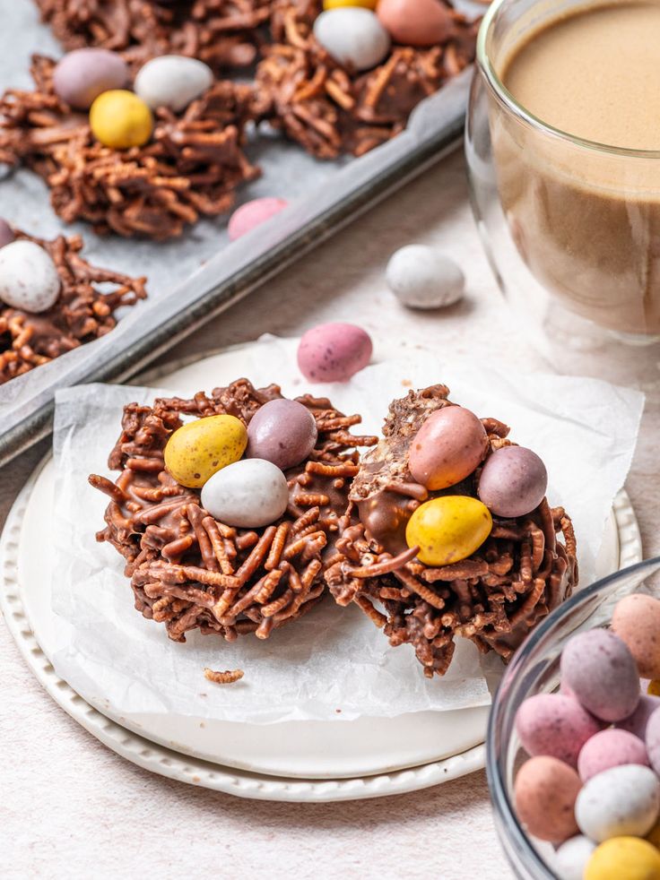 chocolate bird's nest cookies on a plate with candy eggs