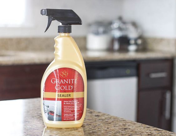 a bottle of granite cleaner sitting on top of a counter