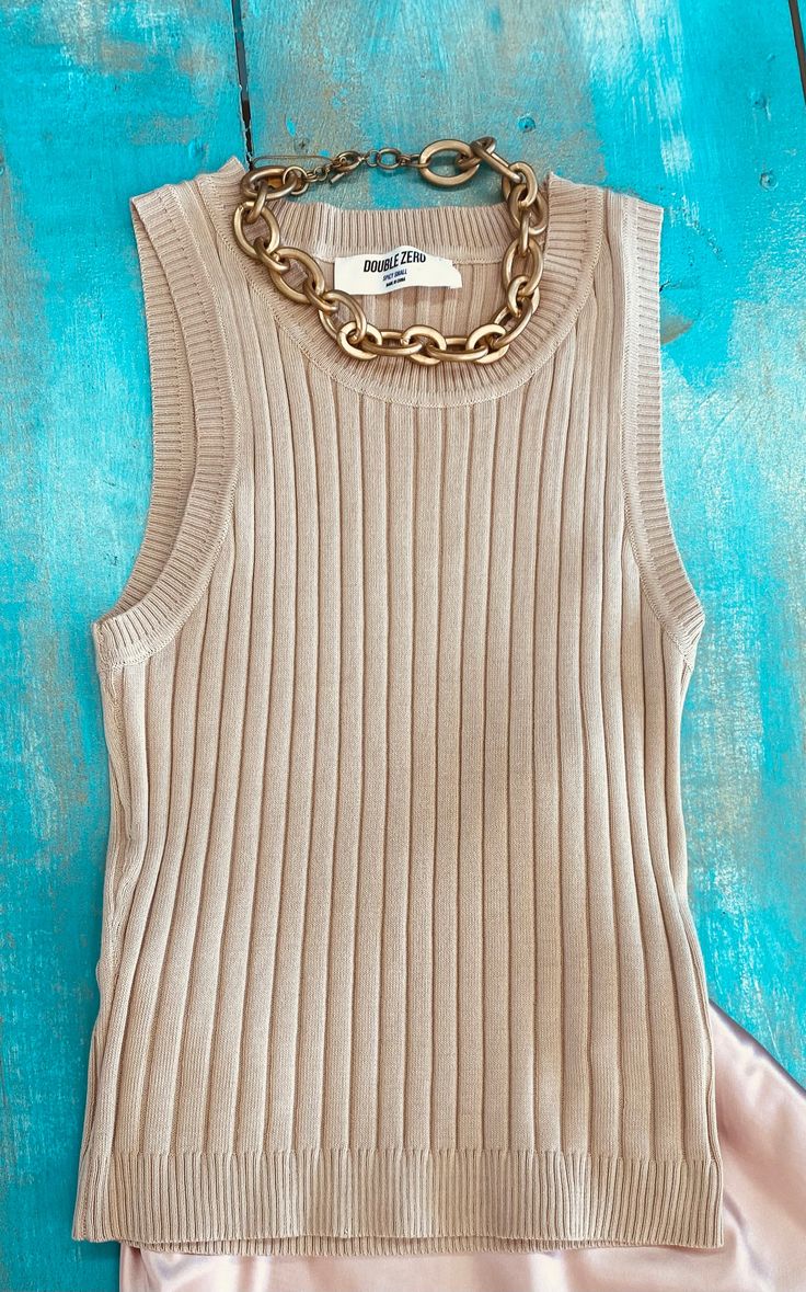 This basic knit top is an essential to every closet. Pairs with causal or dressy business attire. Banded neckline, shoulders and hemline. Available colors: Peach and Caffe Latte Chic Ribbed Crew Neck Tank Top, Chic Solid Color Crew Neck Tank Top, Ribbed Tank Top For Fall Day Out, Fall Ribbed Tank Top For Day Out, Chic Seamless Knit Top, Chic Scoop Neck Knit Top For Layering, Trendy Tank Knit Top For Layering, Chic Ribbed Fitted Knit Top, Chic Scoop Neck Knit Top For Everyday