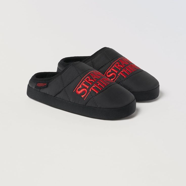 Zara Stranger Things Tm Netflix Slippers Black Indoor Slippers With Rubber Sole, Black Rubber Sole Slippers For Indoor Use, Indoor Black Slippers With Rubber Sole, Black Casual Slippers For Indoor Use, Casual Black Indoor Slippers, Black Synthetic Slippers With Rubber Sole, Black Closed Toe Indoor Slippers, Black Sporty Synthetic Slippers, Sporty Black Synthetic Slippers