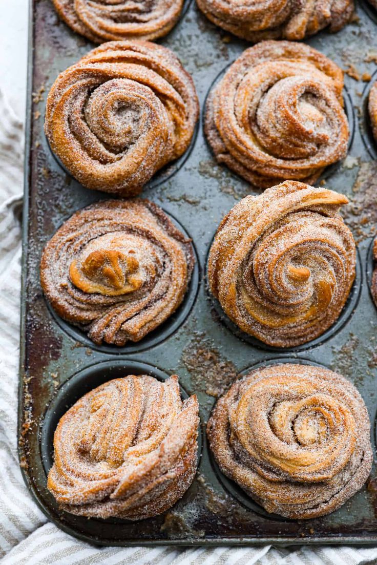 freshly baked cinnamon rolls on a baking sheet