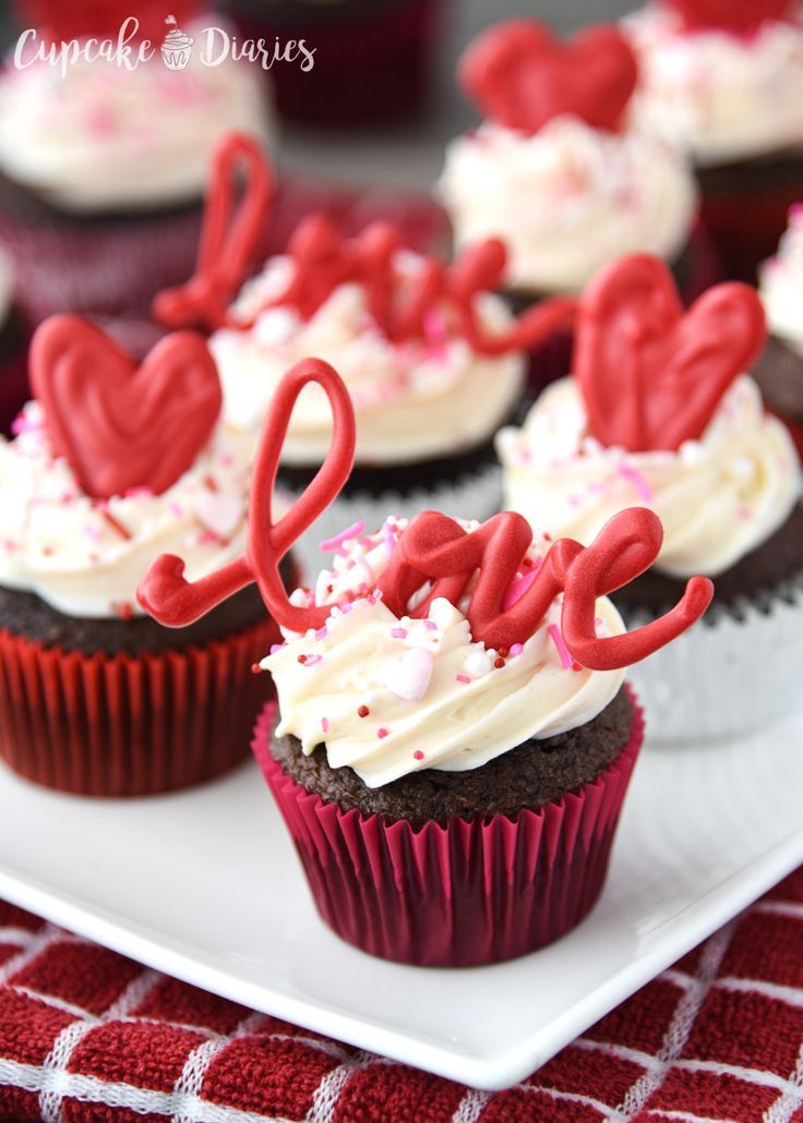 cupcakes with hearts and the word love on them