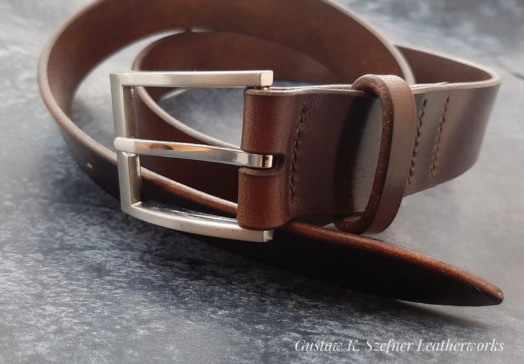 Leather belt, carefully handcrafted. Made of vegetable tanned natural cowskin from Poland. Sewn with SLAM threads. Edges burnished and painted with Fiebing's paint.  You can choose lenght, width (30/35/40 mm) color and type of buckle (made from stainless steel or brass) of your belt - write a private message for this purpose. I want to make my work as planet-friendly as possible. That is why You will receive your product packed with purely plant-based materials. Please see my other auctions! :) Artisan Leather Belts For Gifts, Artisan Leather Belt For Gift, Brown Leather Belts And Suspenders For Gift, Brown Leather Belts And Suspenders As Gifts, Brown Leather Belt And Suspenders As Gift, Brown Leather Belt And Suspenders For Gift, Handmade Leather Belt Buckles In Brown, Artisan Handmade Leather Belt, Handmade Brown Leather Belt Buckles