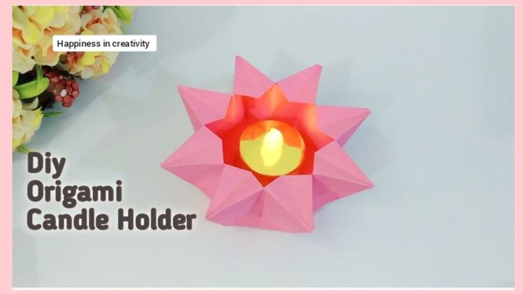 an origami candle holder is shown with the words diy origami candle holder